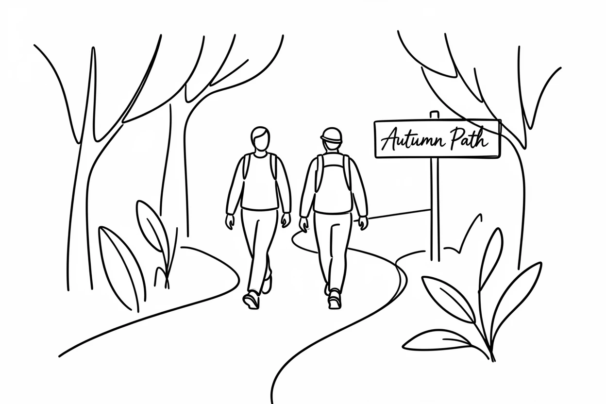 A pair of hikers following a winding trail through an autumn forest