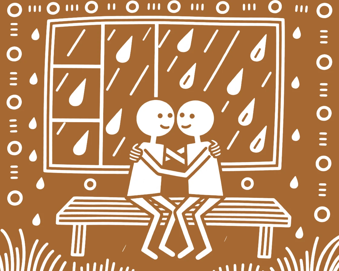 Twin brothers comforting one another after a hard day by a window during the monsoon.