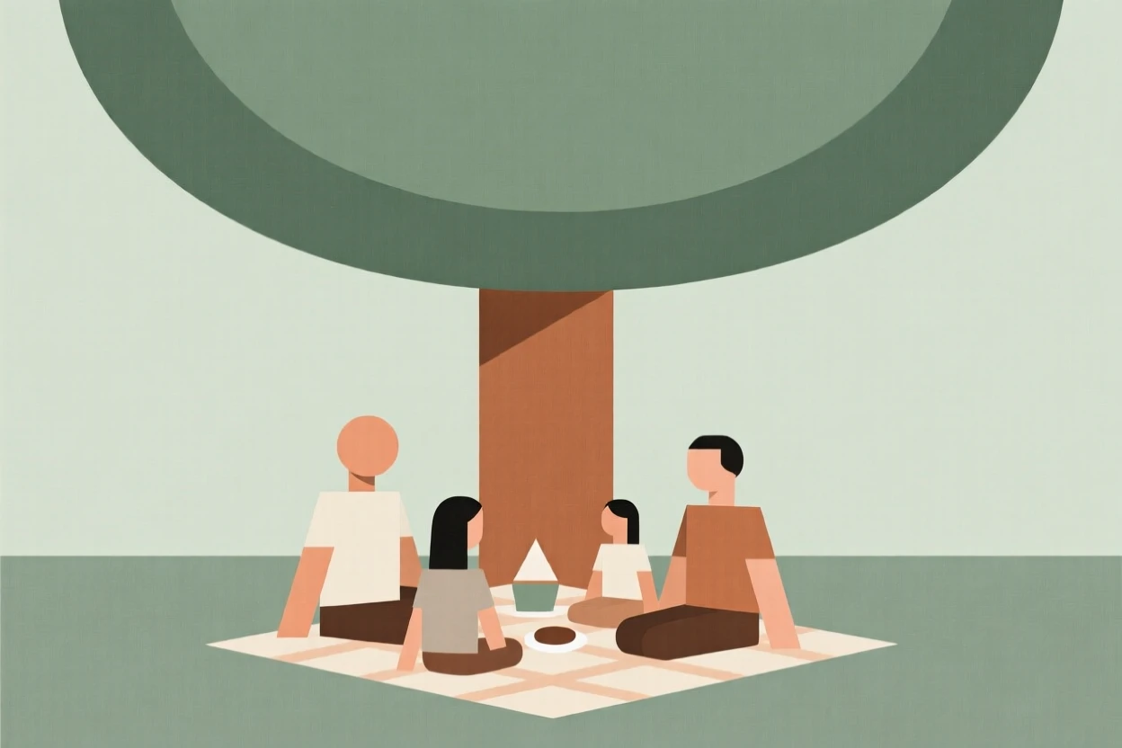 A family having a picnic under a large tree