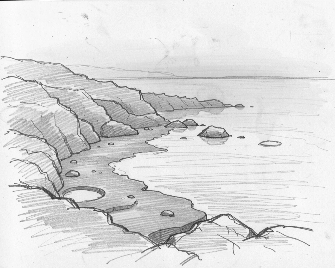 A rugged coastline at low tide, shrouded in gentle fog, with reflections mirrored perfectly in still water.