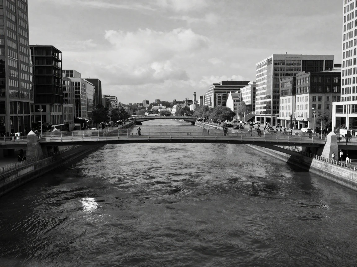 A modern glass bridge spans a wide river below connecting two busy districts.