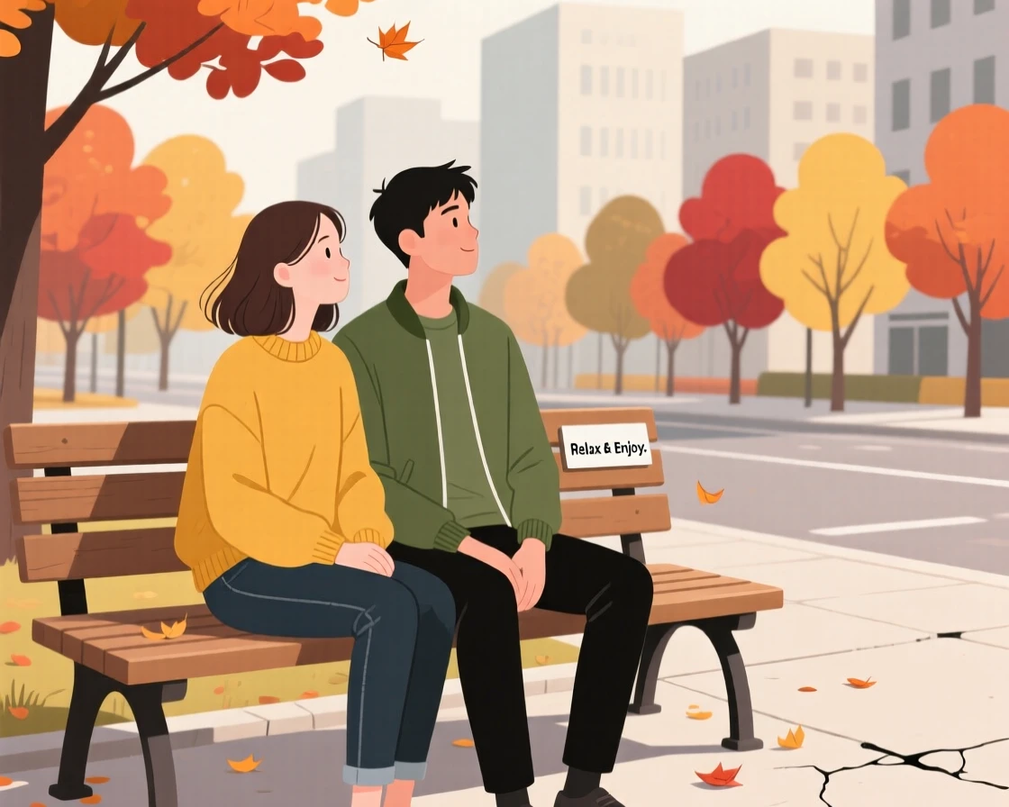 A young couple people-watching from a bench on a quiet autumn day in the city.