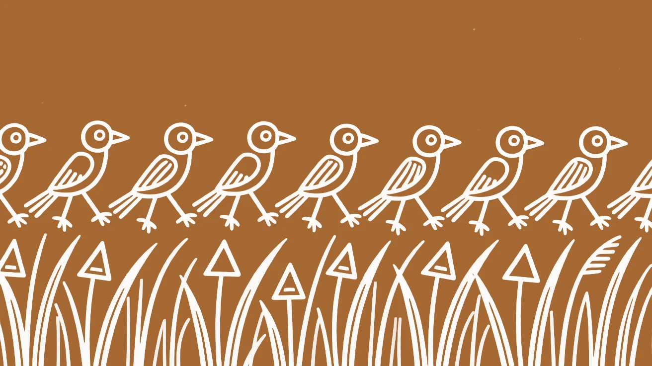 A flock of parrots crossing a field of tall grass.