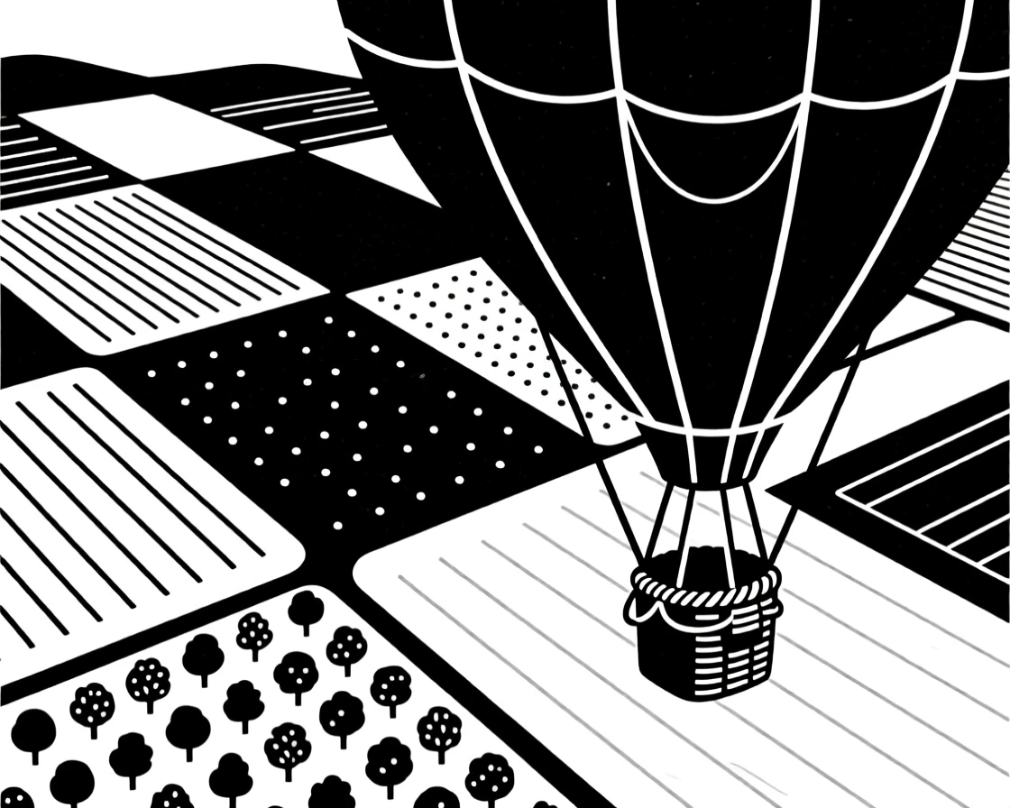 A patchwork of farmland seen from a hot air balloon.