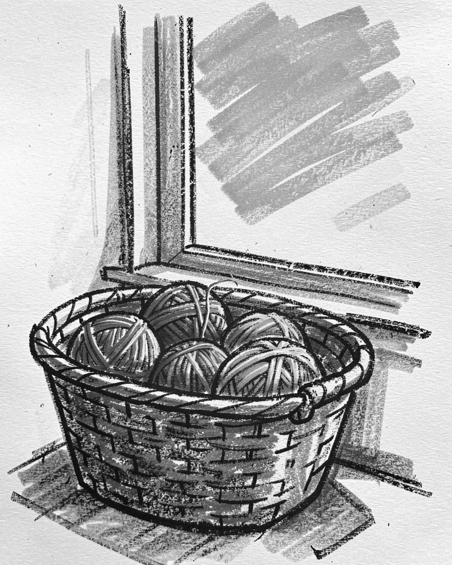 A knitting basket filled with colorful yarn beside a window, under a clear blue midday sky.